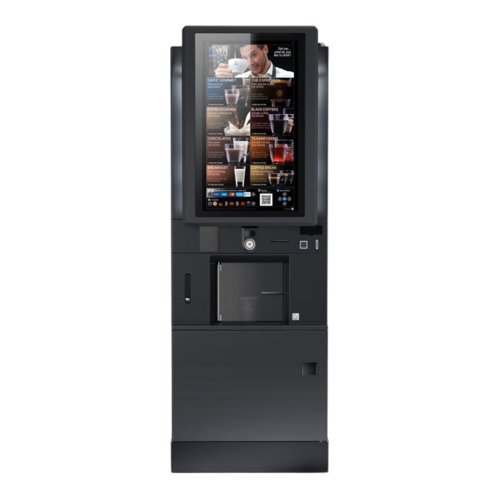 Een Rhea Vendors RhFS2.touch32EE8R4 vrijstaande koffieautomaat met een groot opvallend 32-inch touchscreen voor een uitgebreide keuze en interactieve bediening, opgesteld in de ontmoetingsruimte voor het bereiden van diverse koffiespecialiteiten met vers gebrande bonen. voor aanzicht