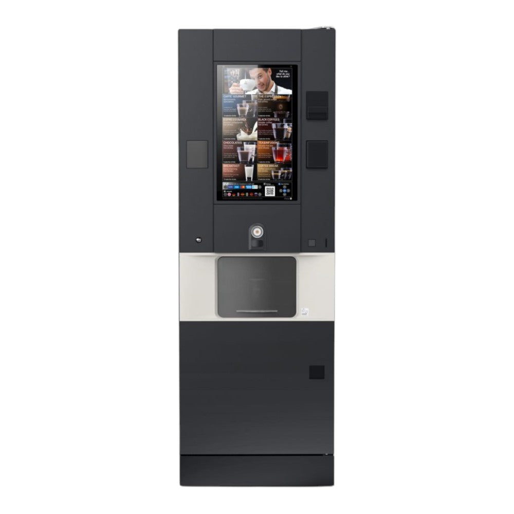 Een Rhea Vendors rhFS1.touchE7R41T vrijstaande koffieautomaat met groot touchscreen en geïntegreerd betaalsysteem, opgesteld in de ontmoetingsruimte voor het bereiden van diverse warme dranken met vers gebrande koffiebonen.